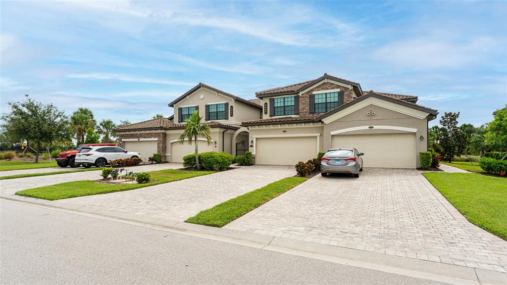 a front view of a house with a yard and garage