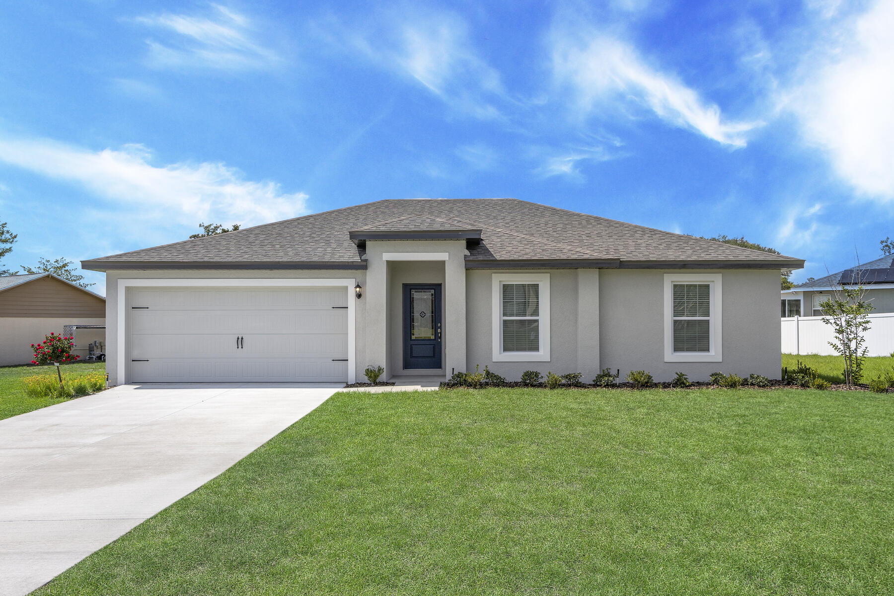 a front view of a house with a yard