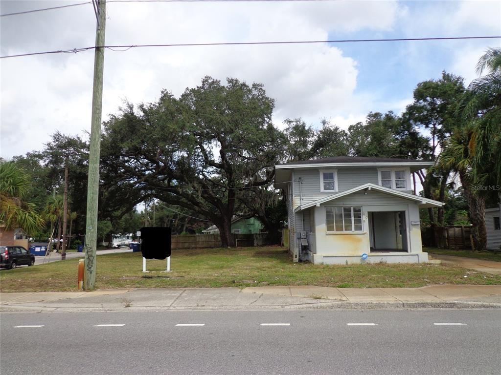 a view of a house with a street