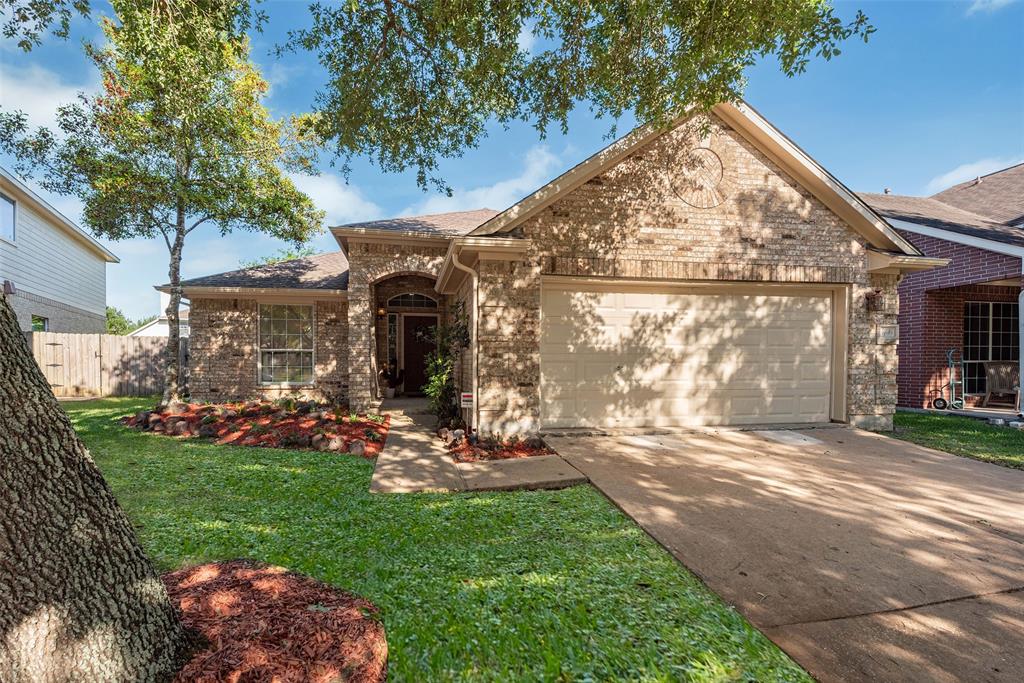 The front view of this gorgeous home on Richfield Park Court! Inviting entry, shaded front yard, manicured landscaping! This is the one!