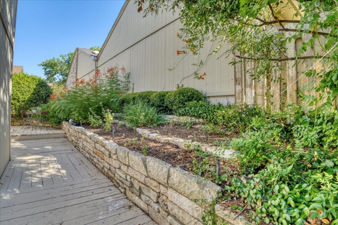 Property entrance with gardens leading to front door.