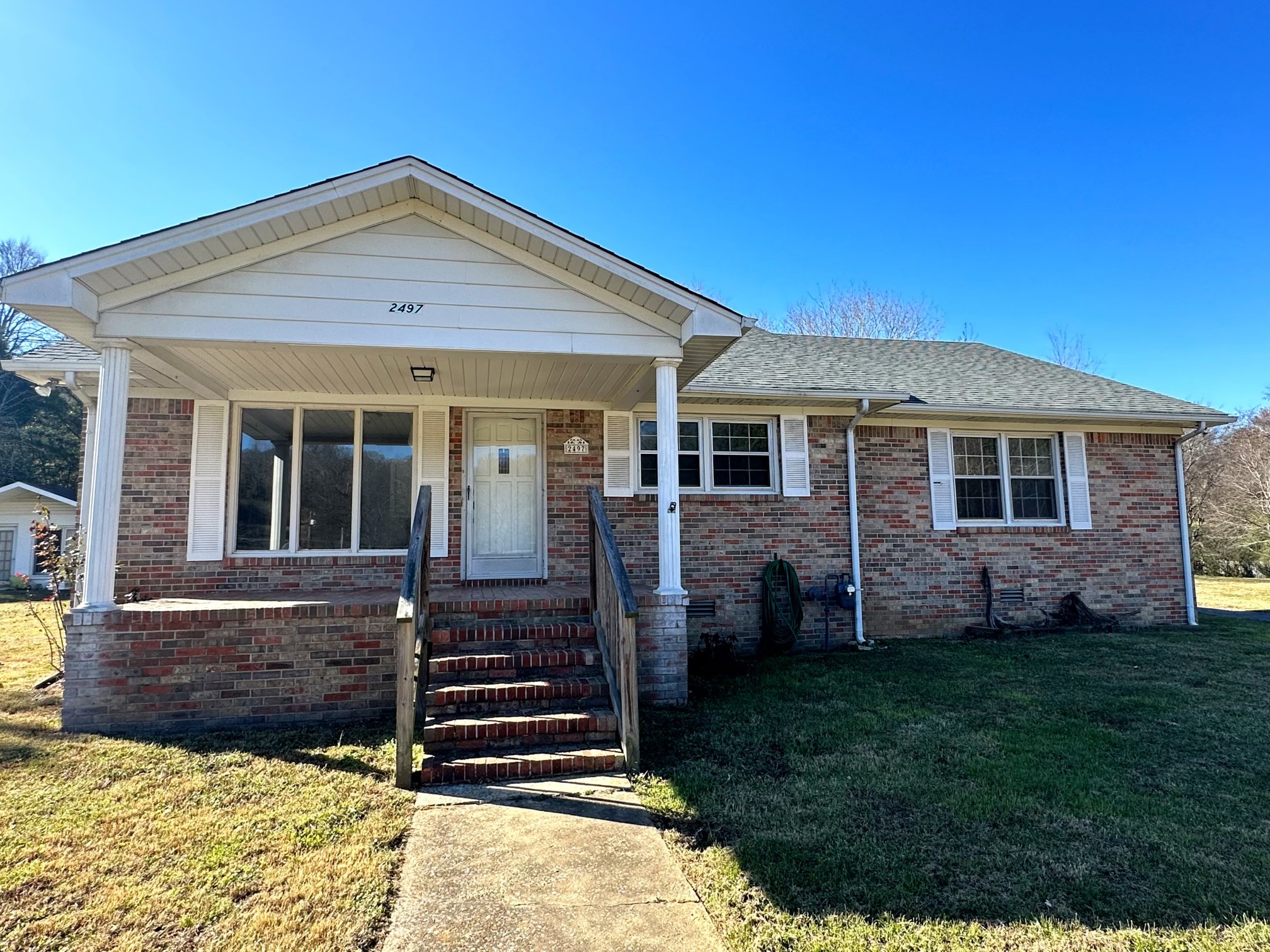 a front view of a house with a yard