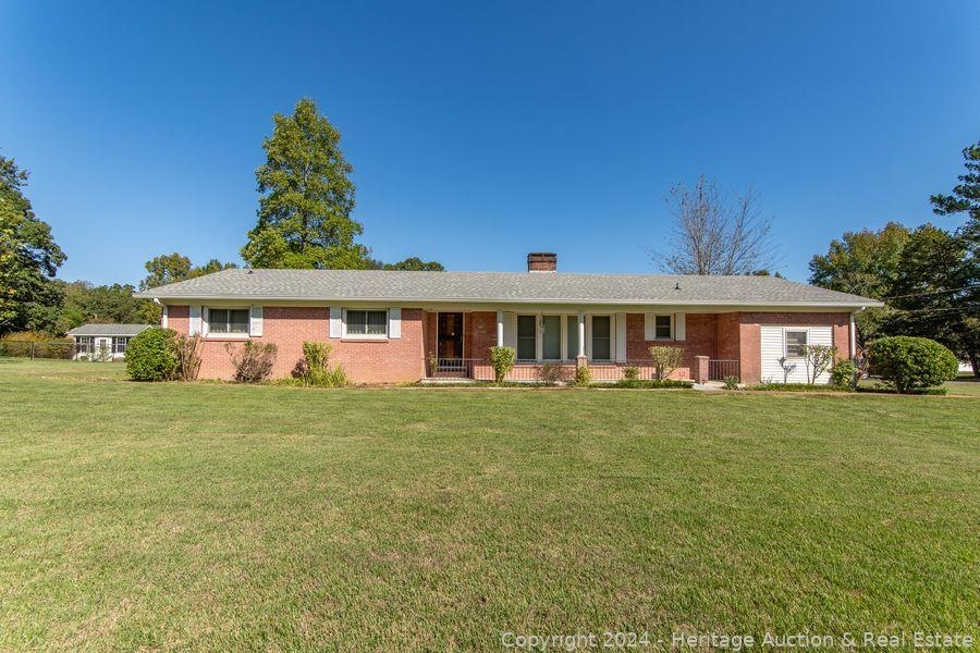 Ranch-style home with a front yard