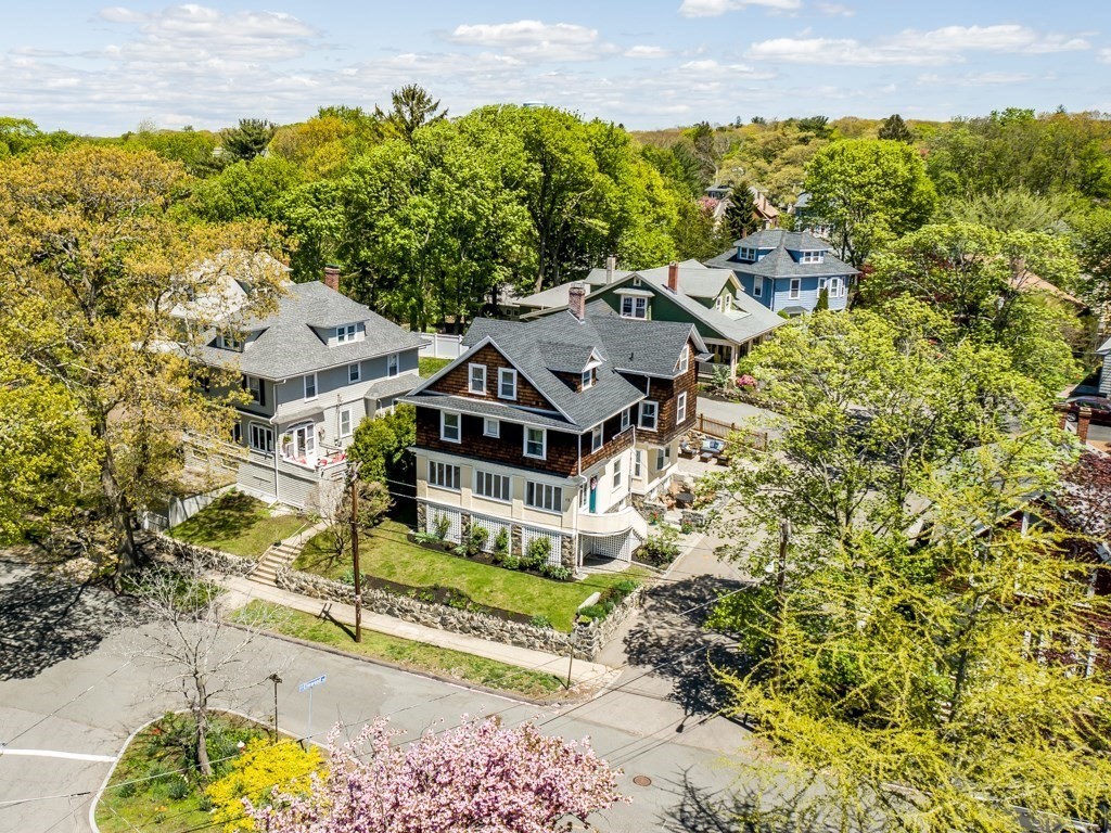 an aerial view of a house with a garden