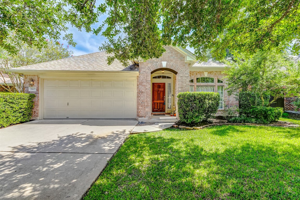 Wonderful one-story home nestled on a flat lot surrounded by mature trees and landscaping!