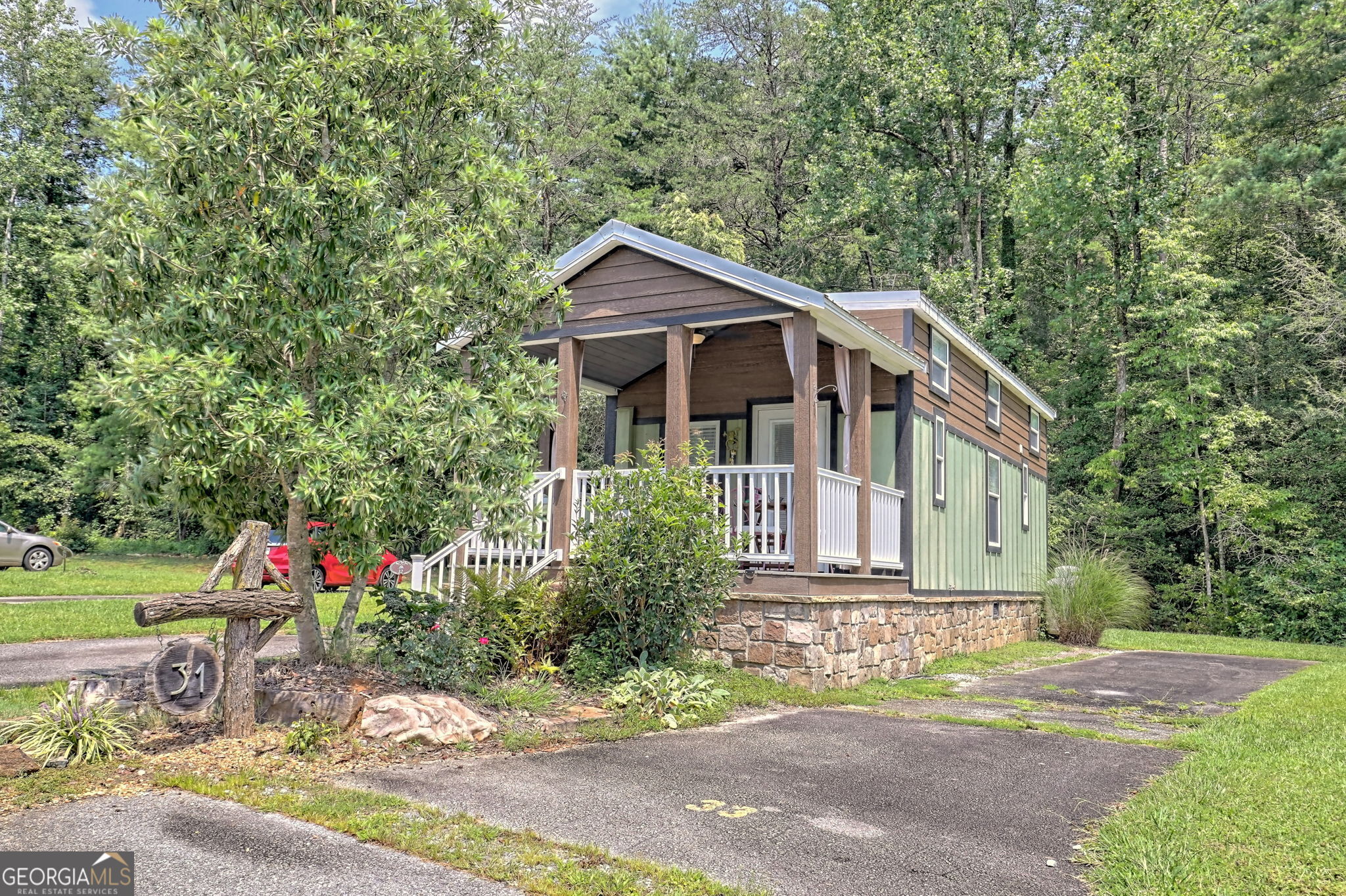 a front view of a house with garden