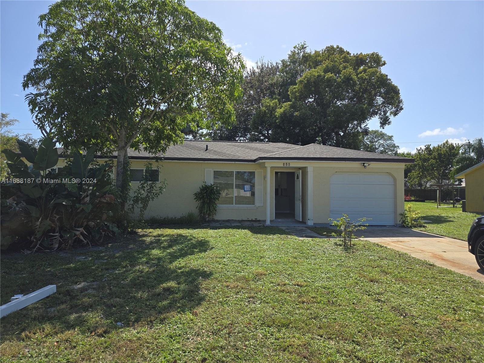 front view of a house with yard