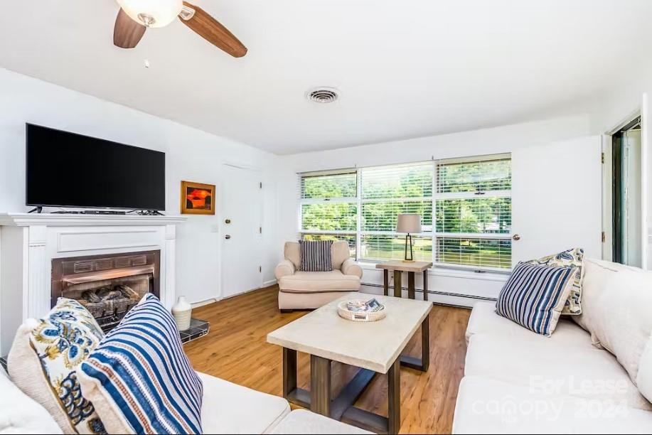 a living room with furniture and a flat screen tv