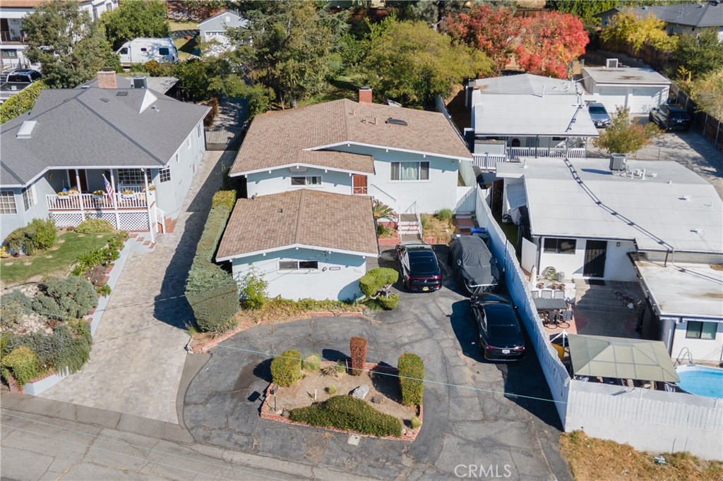 an aerial view of a house with a swimming pool