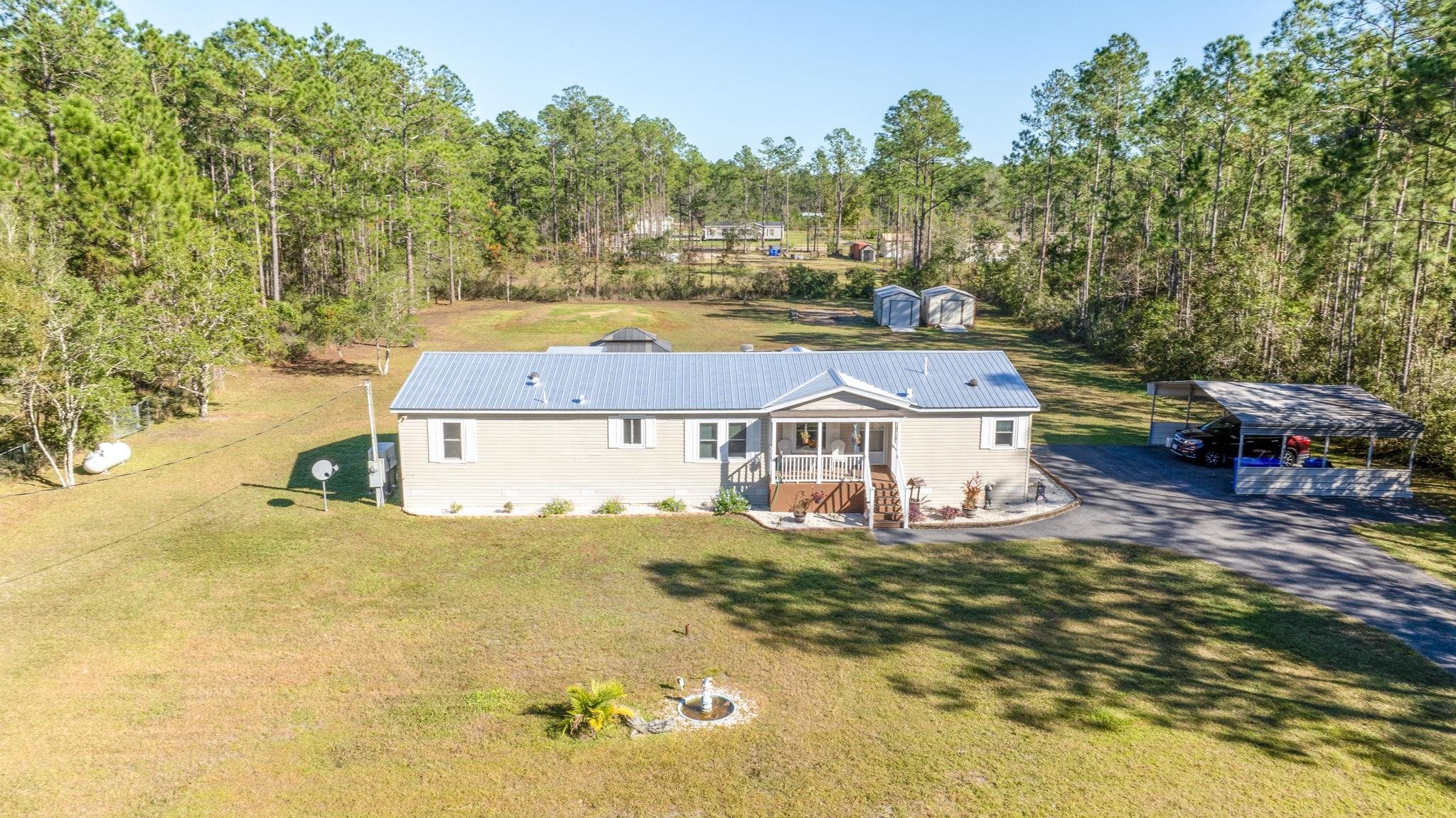 a view of a house with a big yard