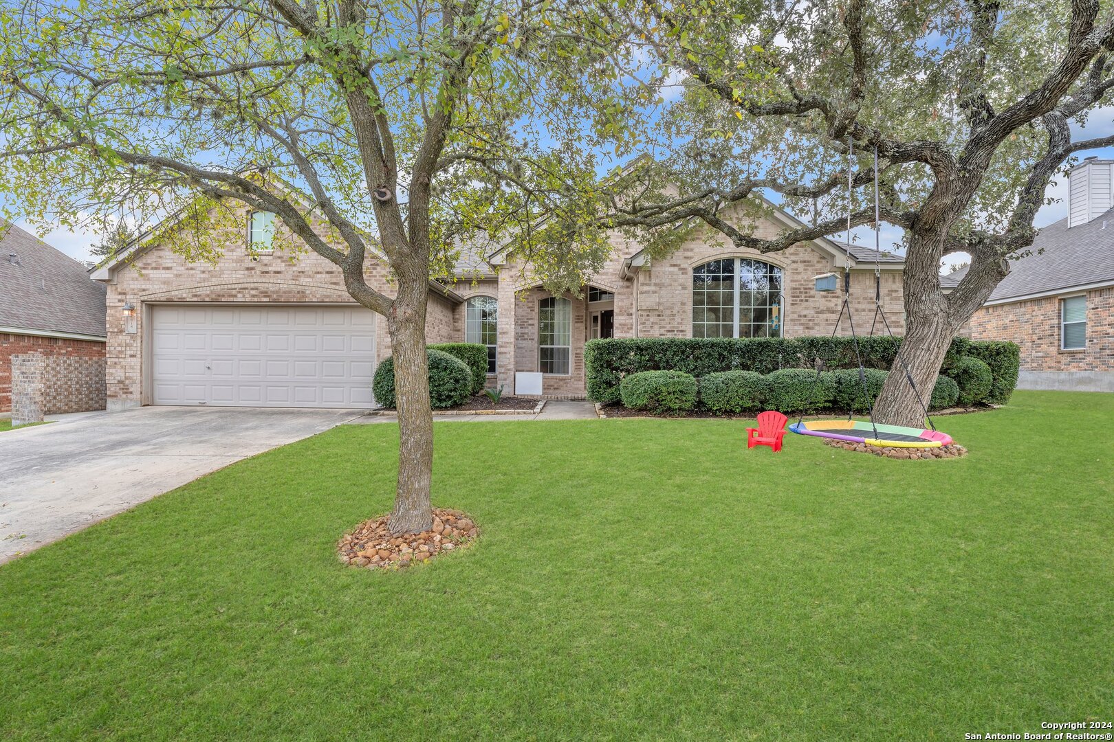 a front view of house with yard and green space