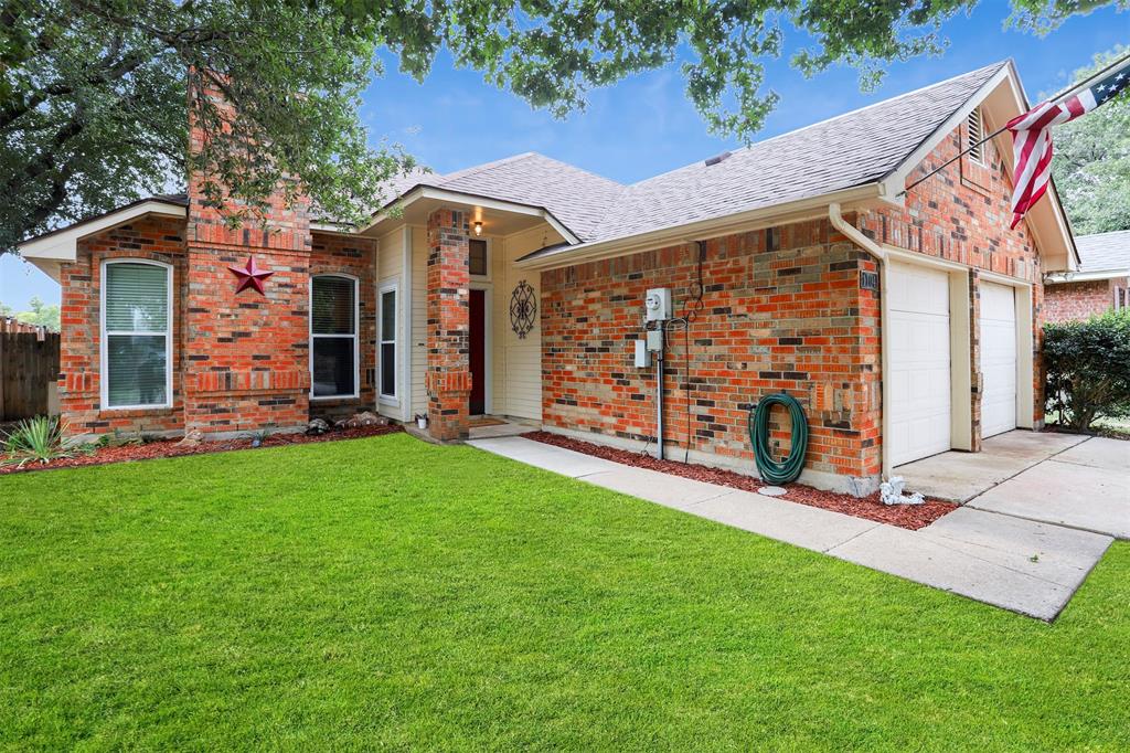 front view of a house with a yard