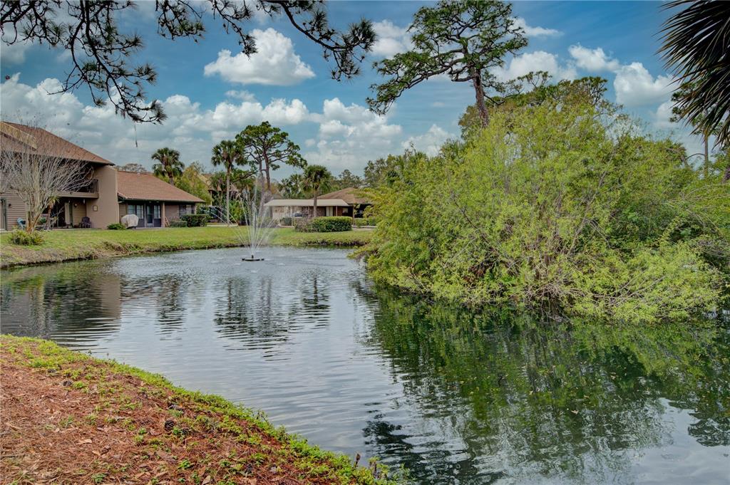 a view of a lake with a house