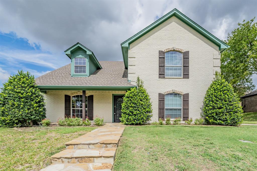 front view of a house with a yard