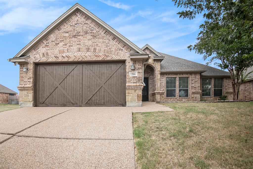 front view of a house with a dry yard