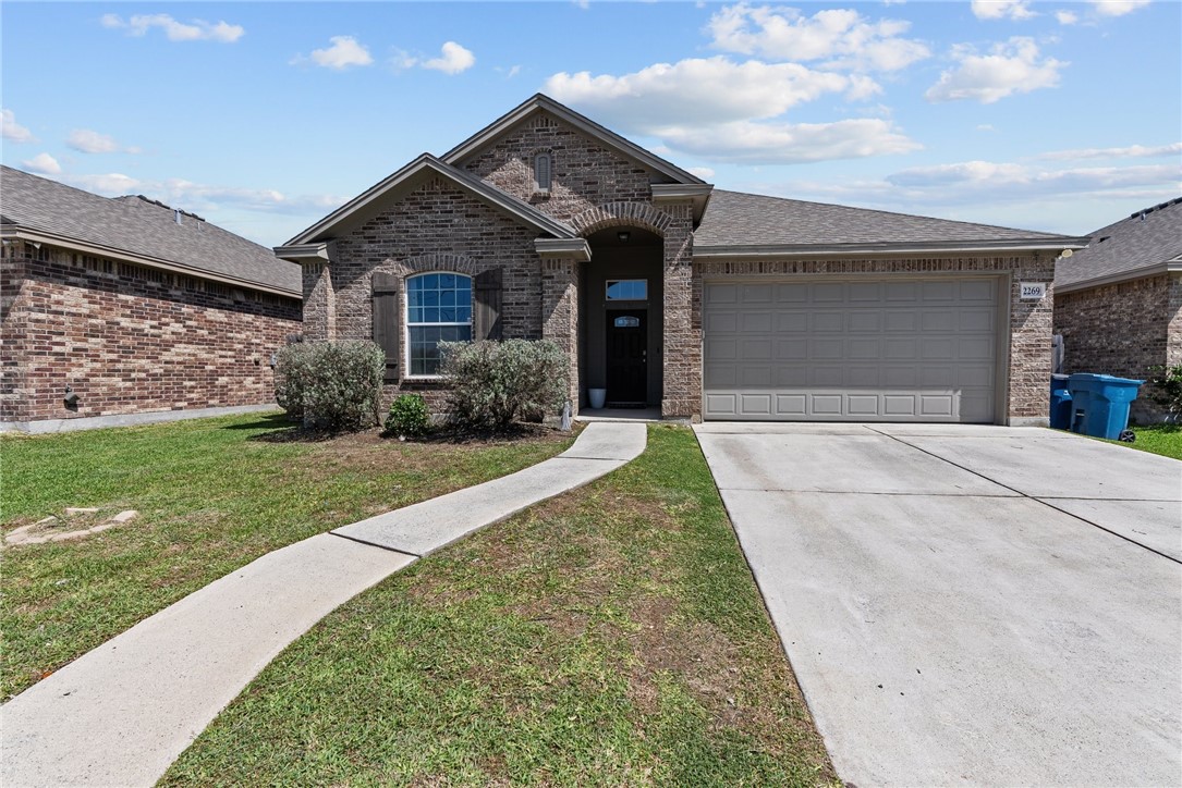 front view of a house with a yard