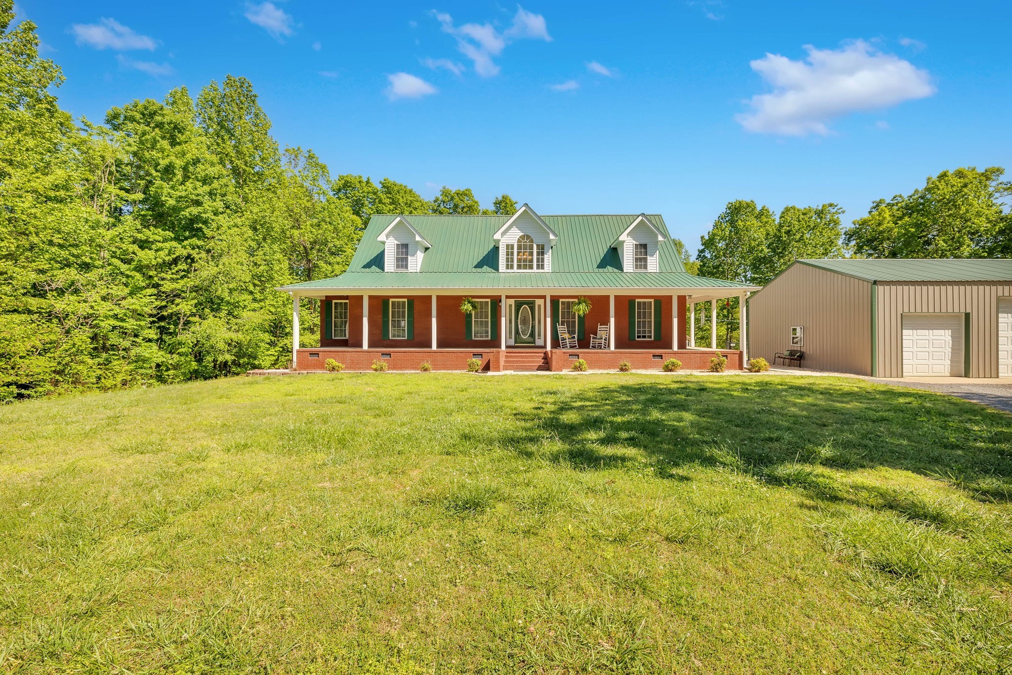 a view of a house with a big yard