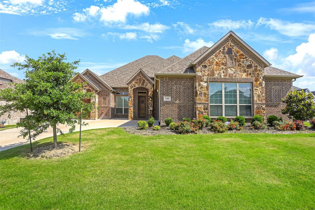 front view of a house with a yard