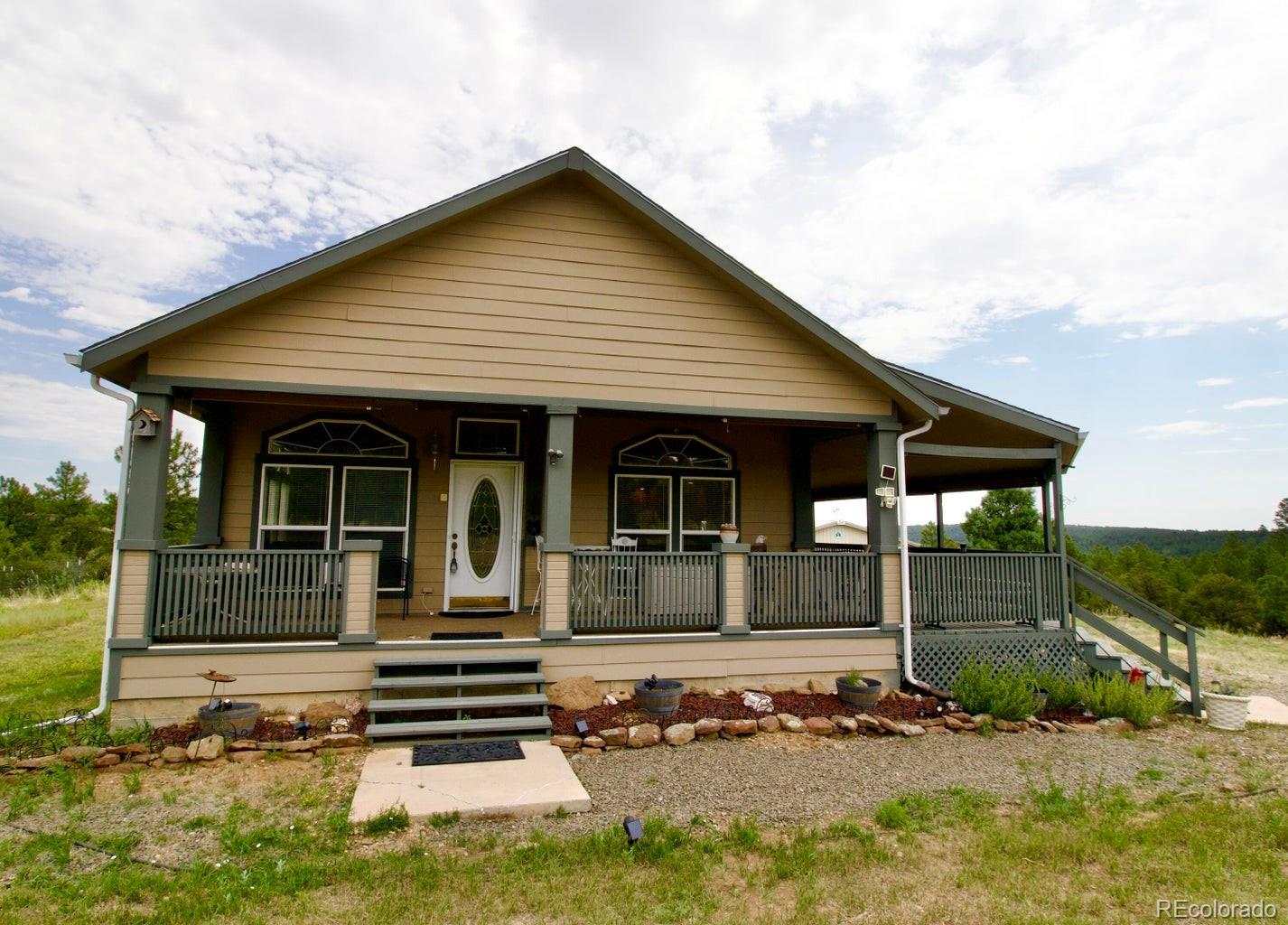 front view of a house with a yard