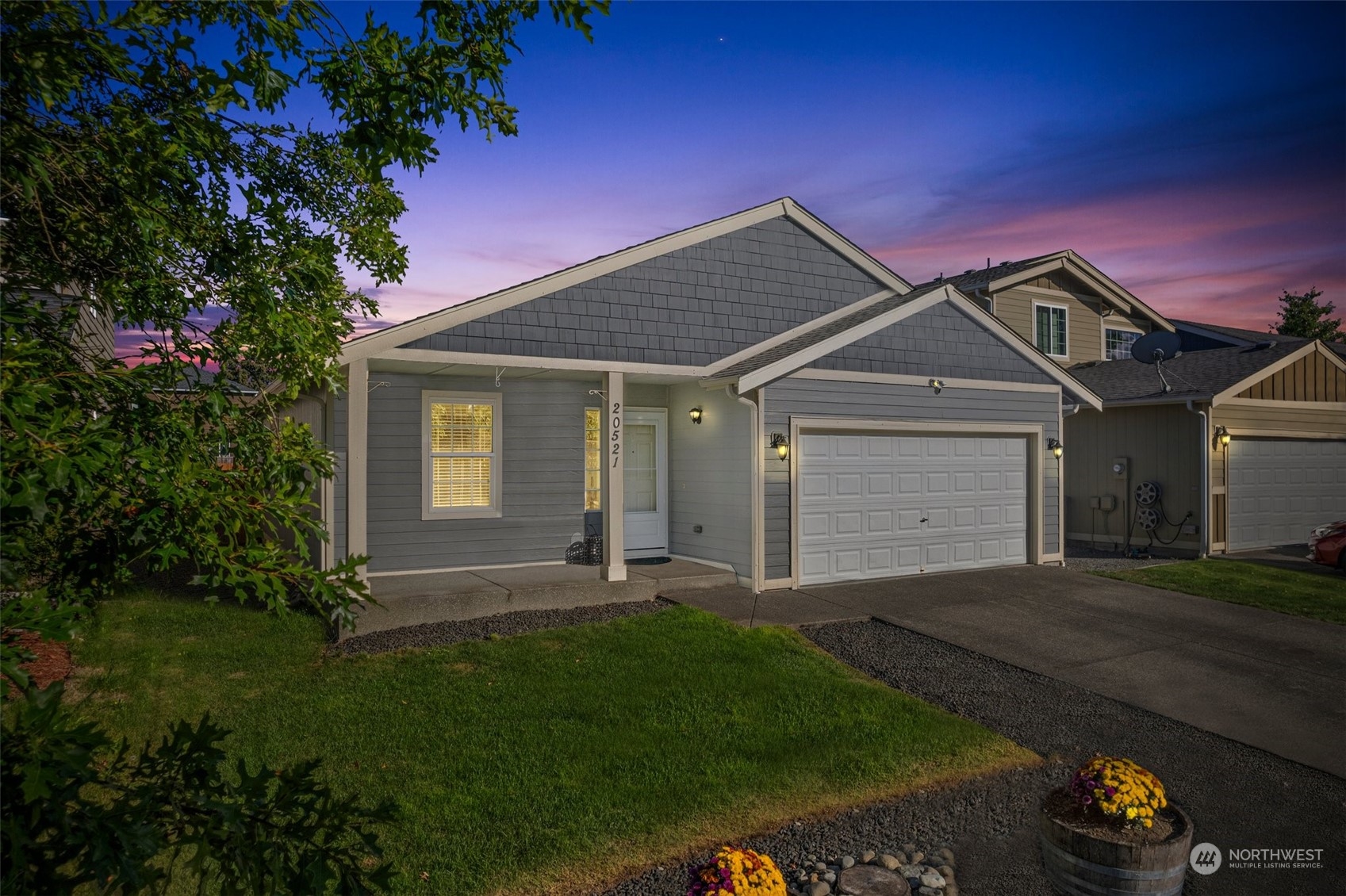 a front view of a house with a yard