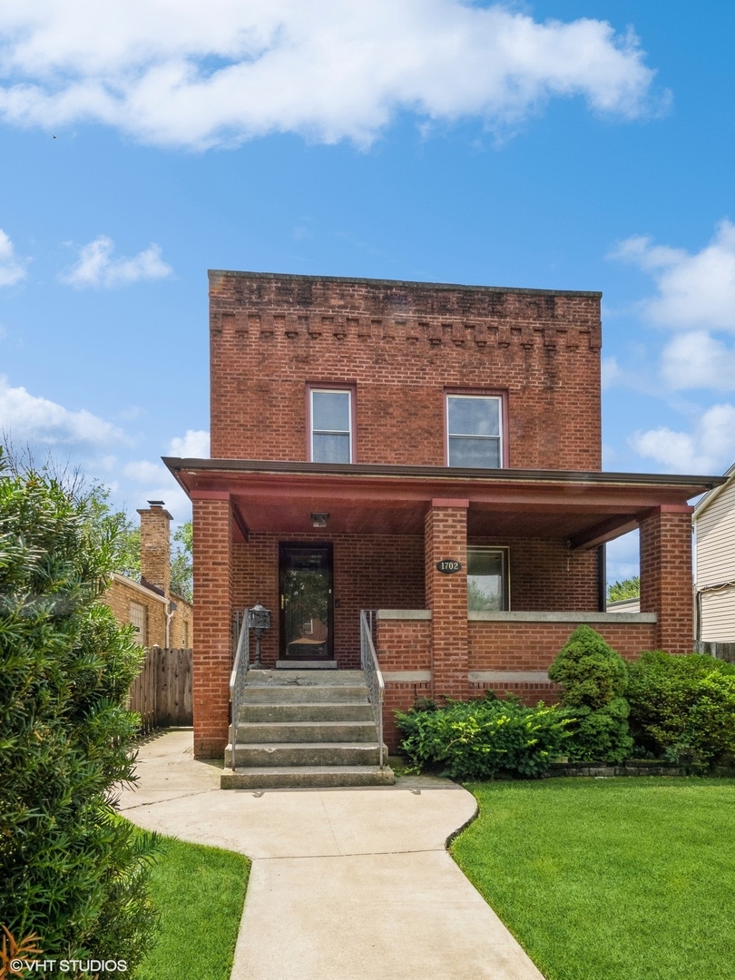 front view of a house with a yard