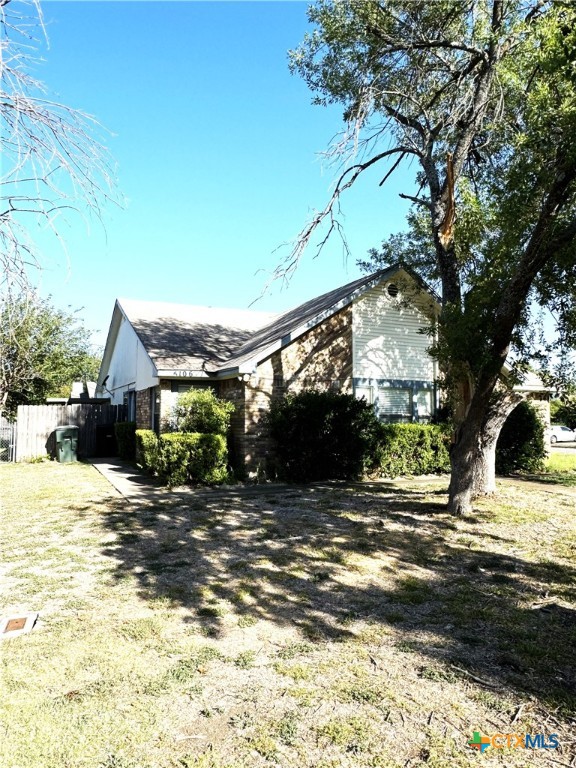 a view of a house with a snow in the yard