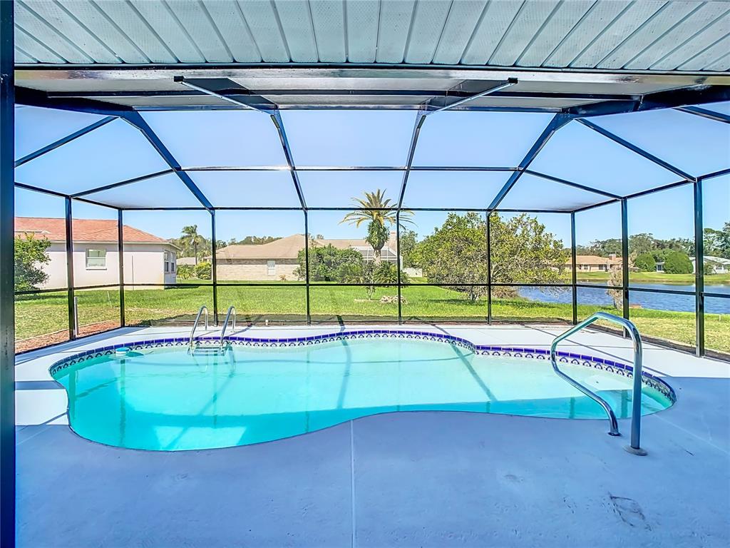 a view of a backyard with a swimming pool