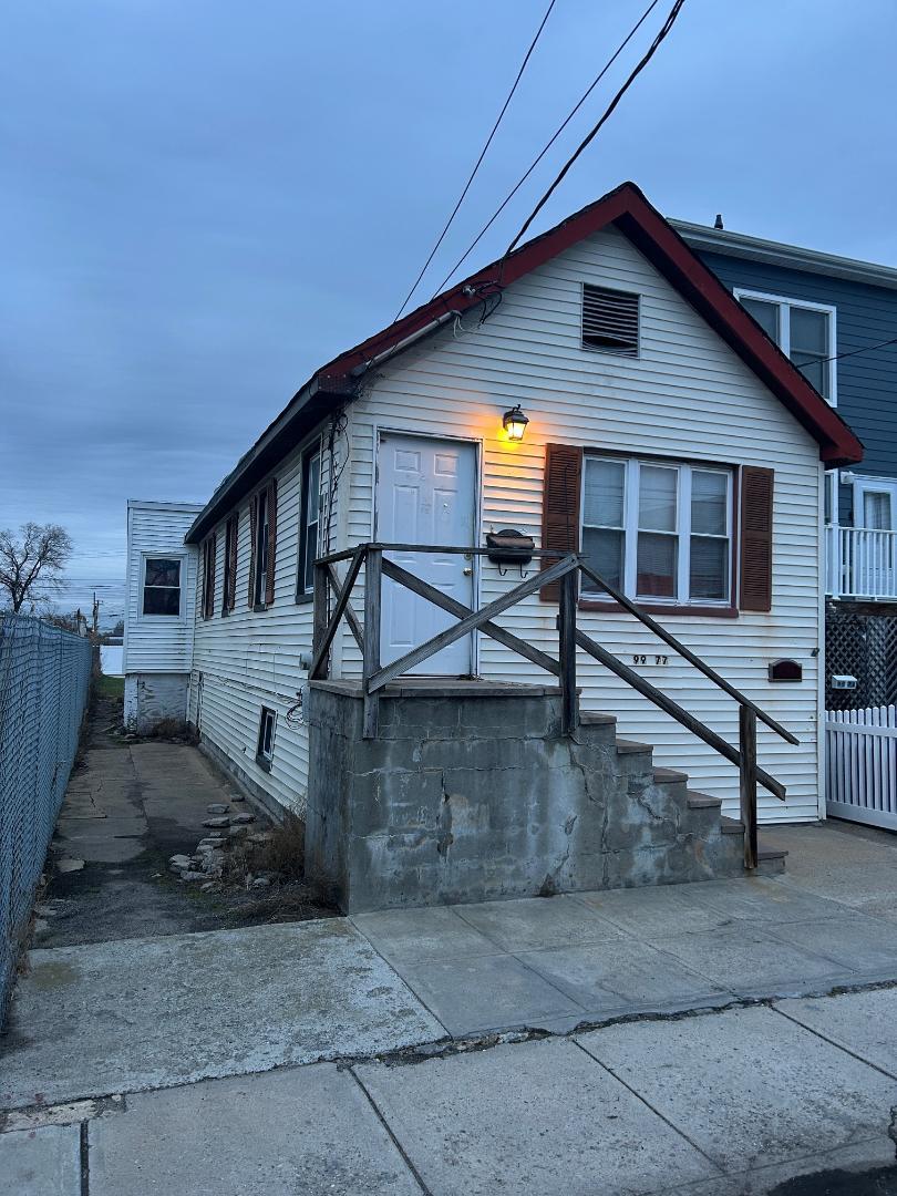 a front view of a house with garage