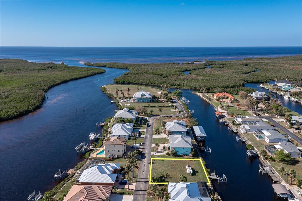 an aerial view of a house with a lake view