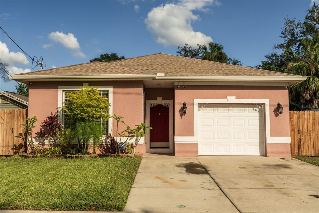 a front view of a house with garden