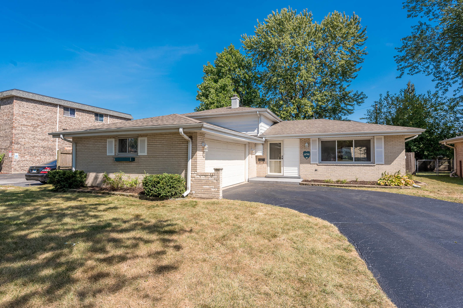 front view of a house with a patio