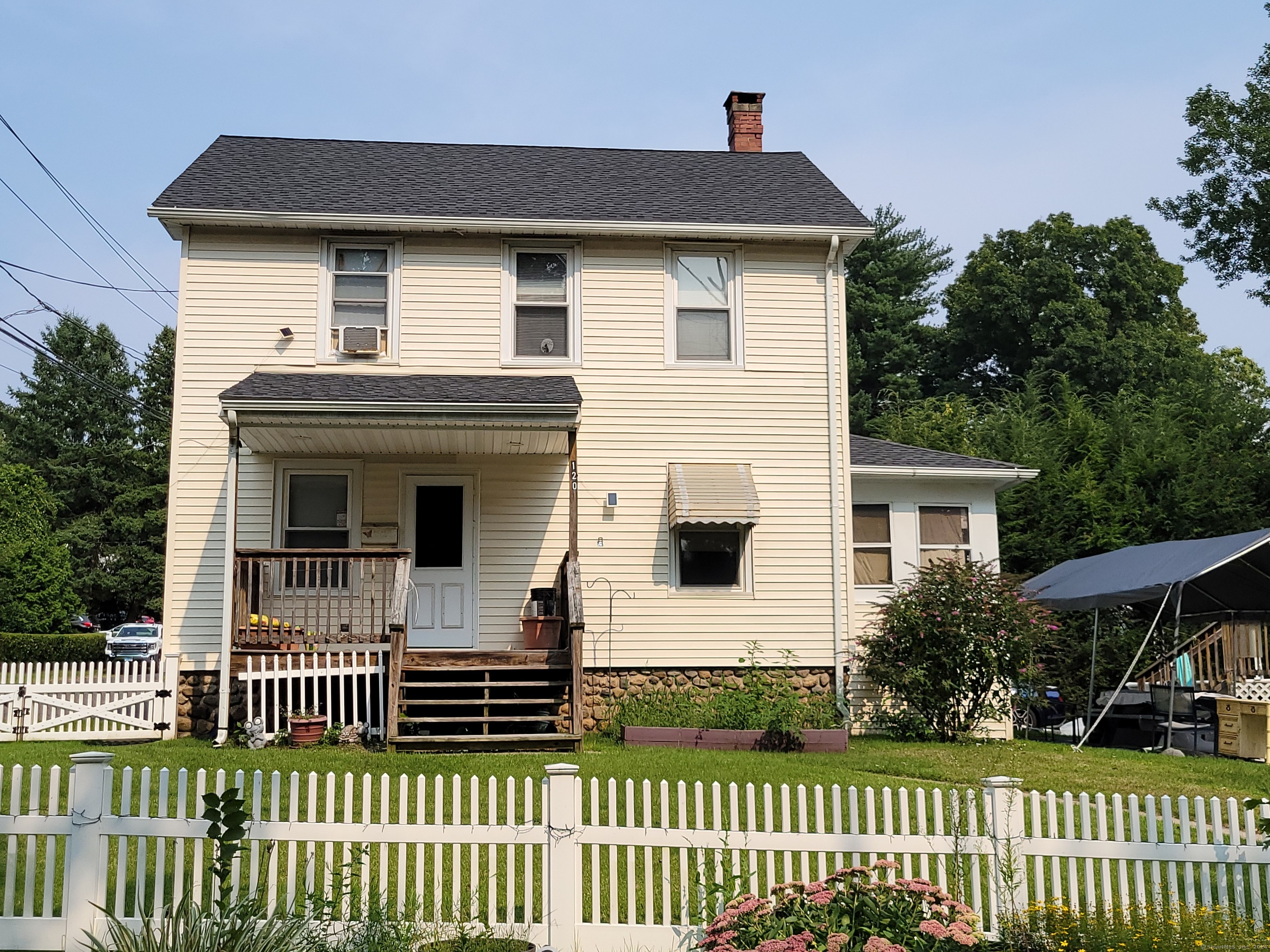 a front view of a house with a porch