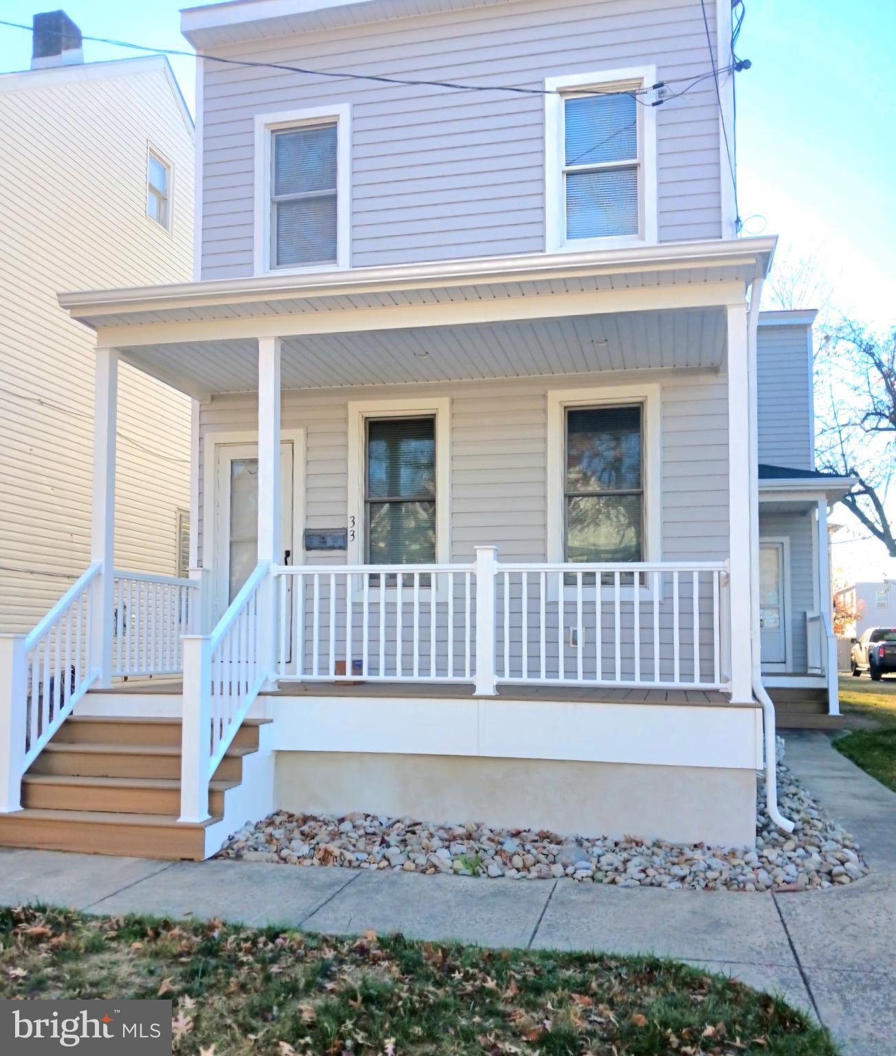 front view of a house with a fence