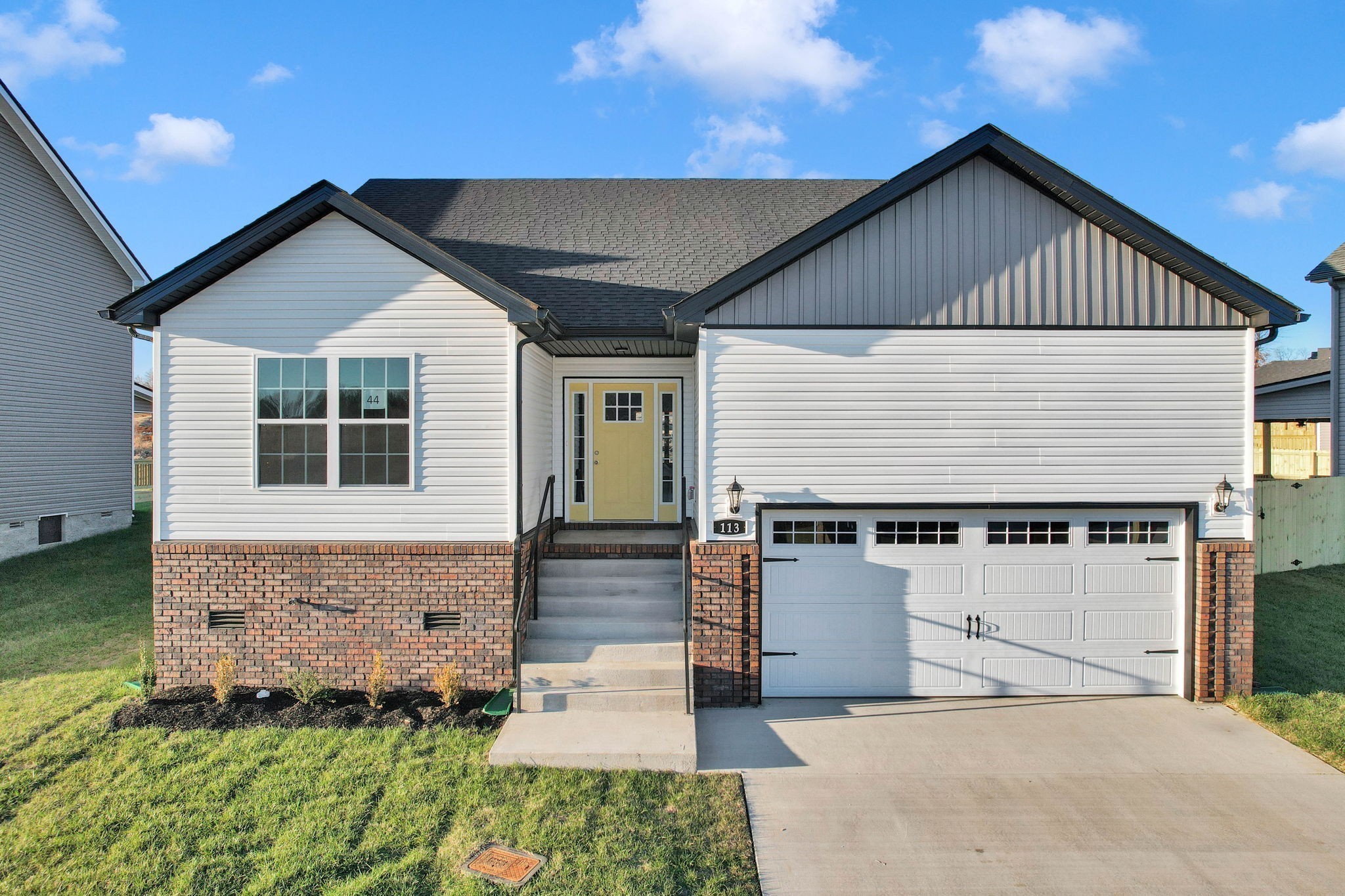 a front view of a house with a yard