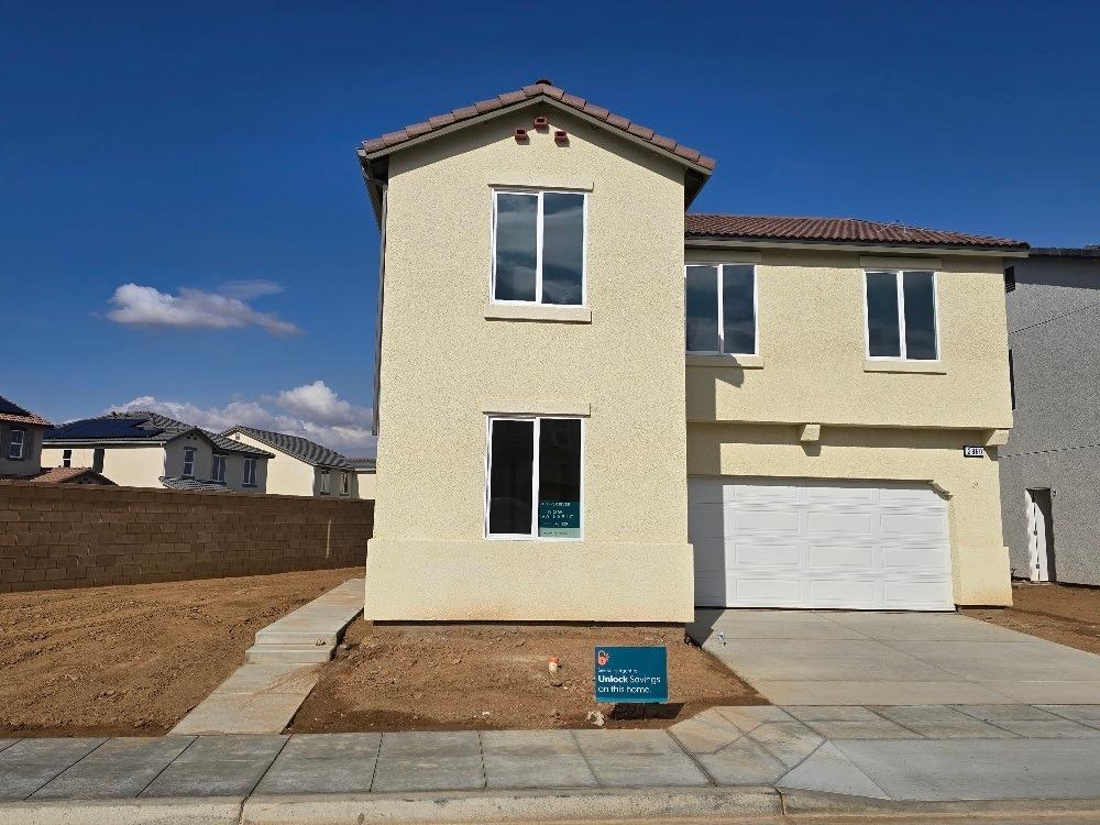 a front view of a house with a garage