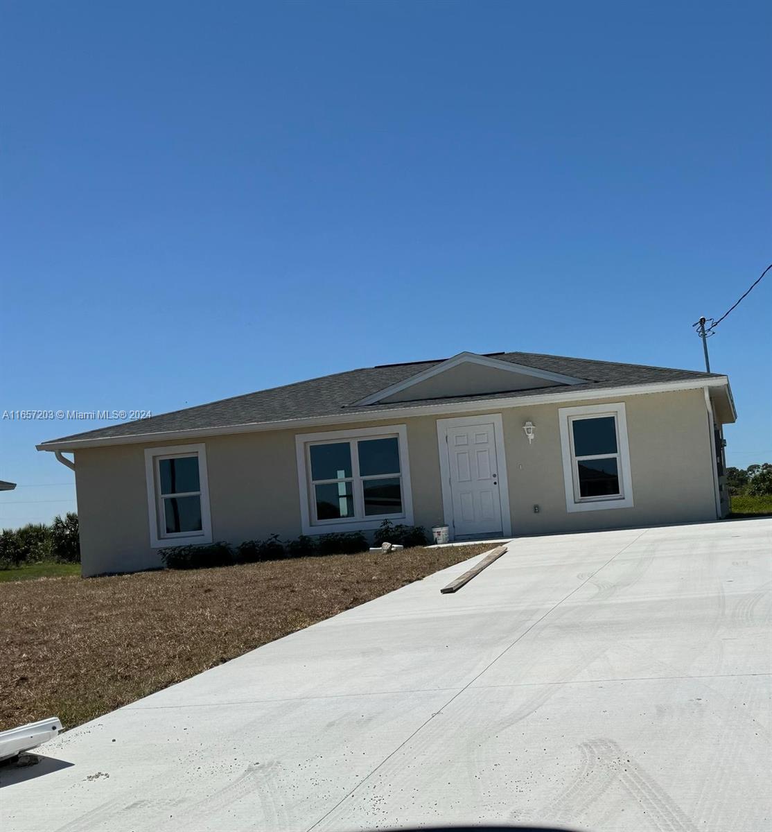 a front view of a house with yard