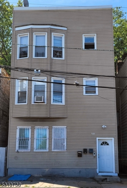 a front view of residential houses with stairs