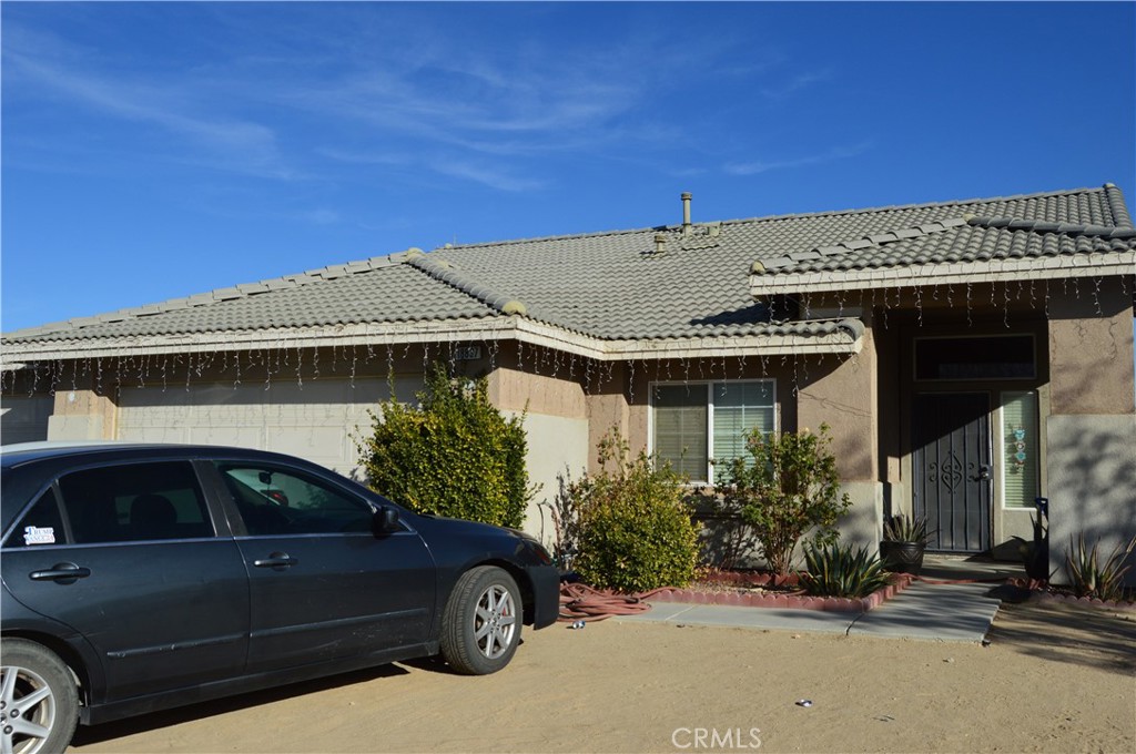 a front view of a house with parking space