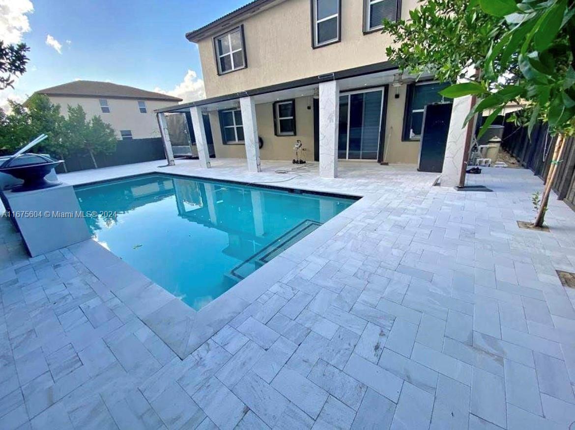 a view of a house with a swimming pool