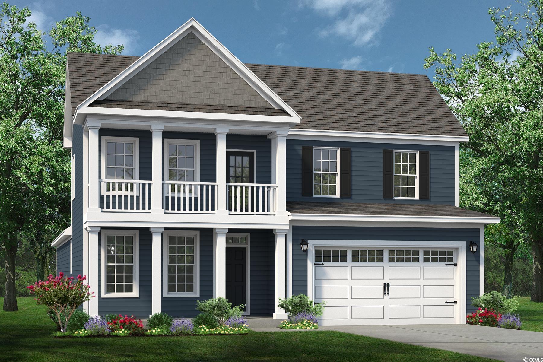 View of front of property with a garage and a fron