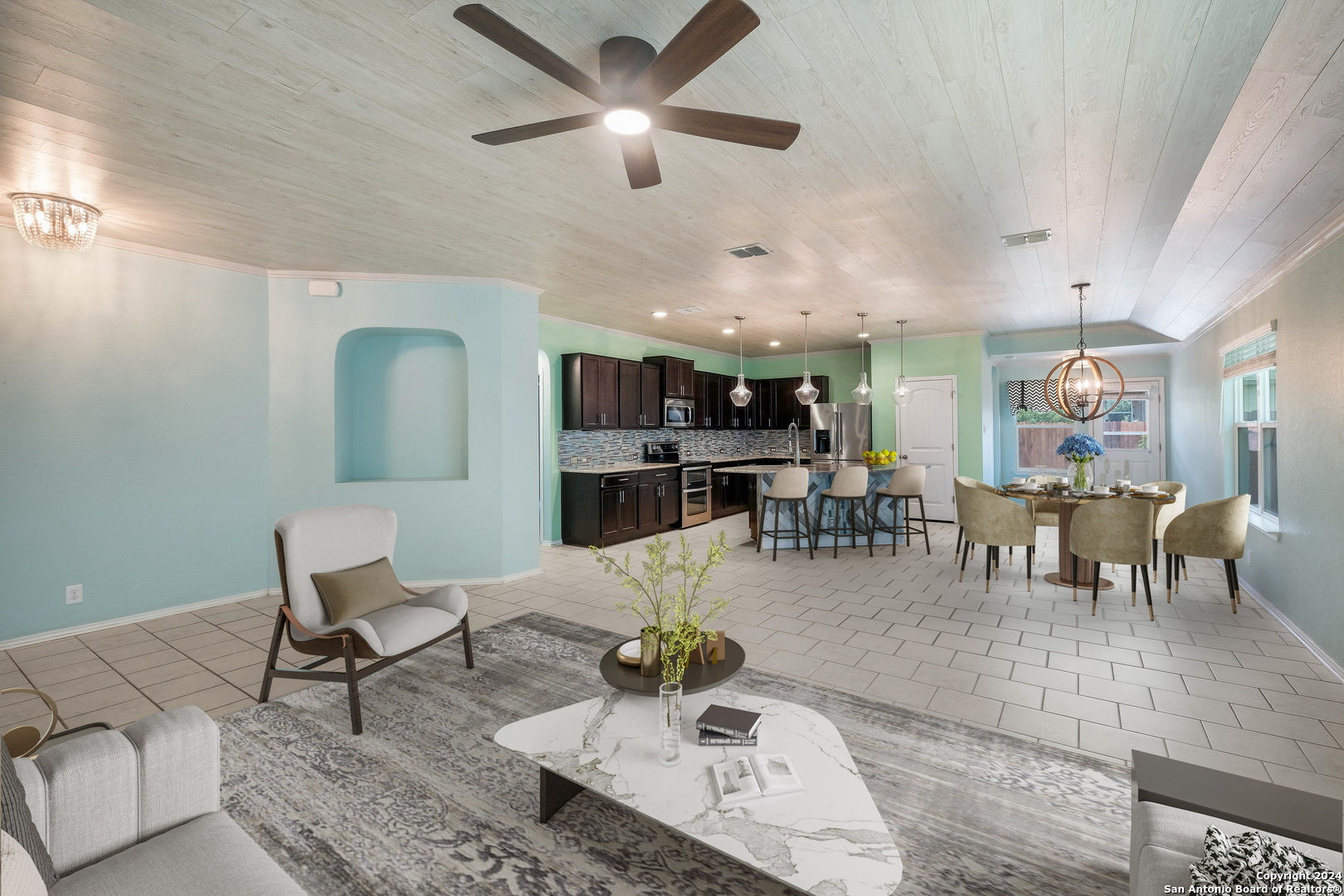 a living room with furniture and kitchen view