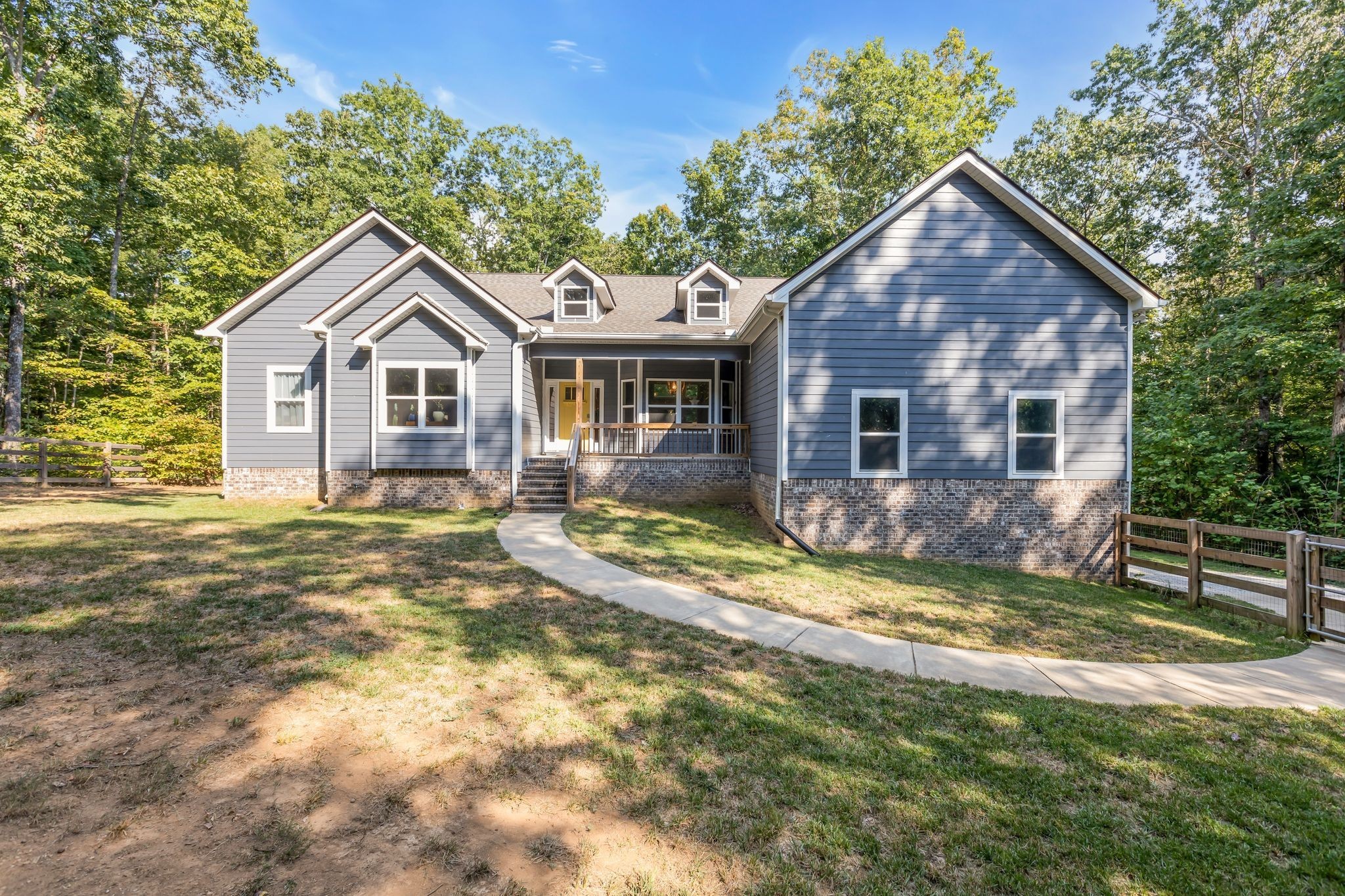 BEAUTIFUL, ONE LEVEL LIVING, WELCOMING FRONT PORCH AND SUNNY DOOR!