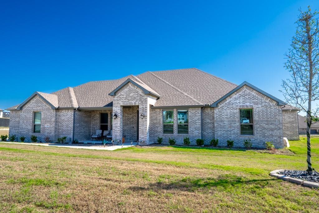 a front view of a house with a yard