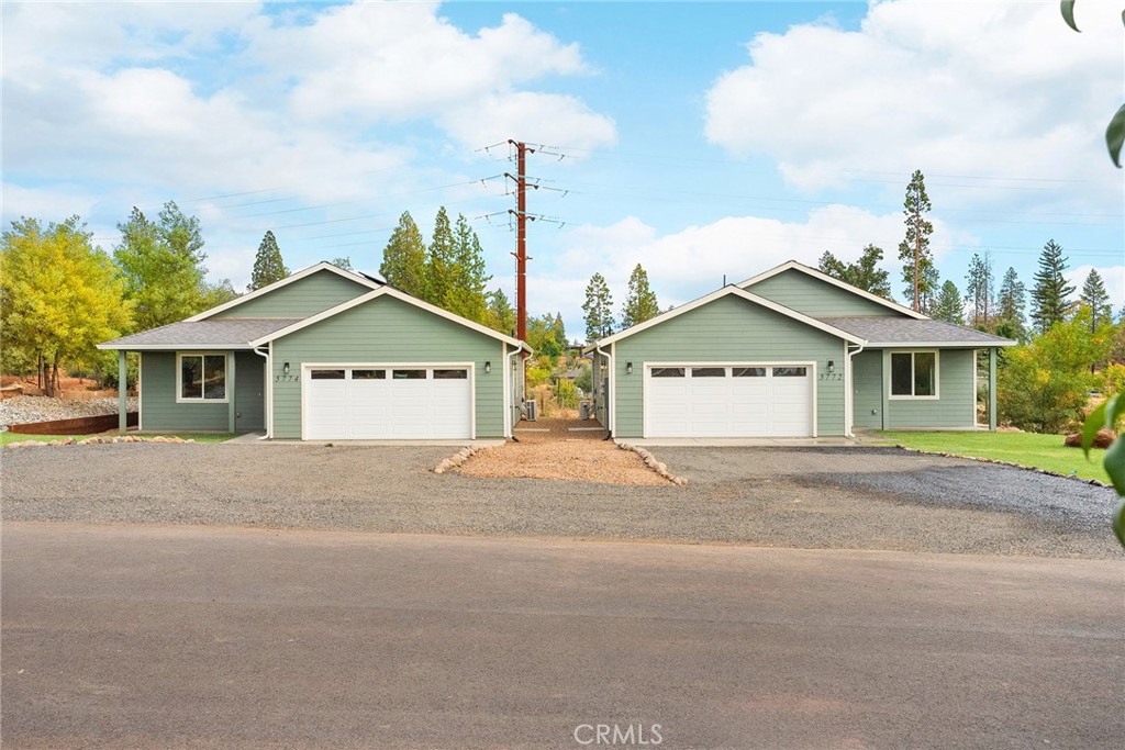 a view of house with outdoor space and street view