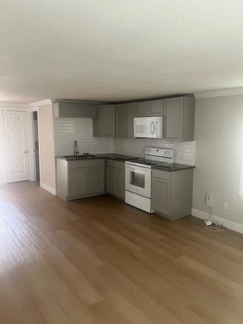 a kitchen with stainless steel appliances granite countertop a stove and a sink