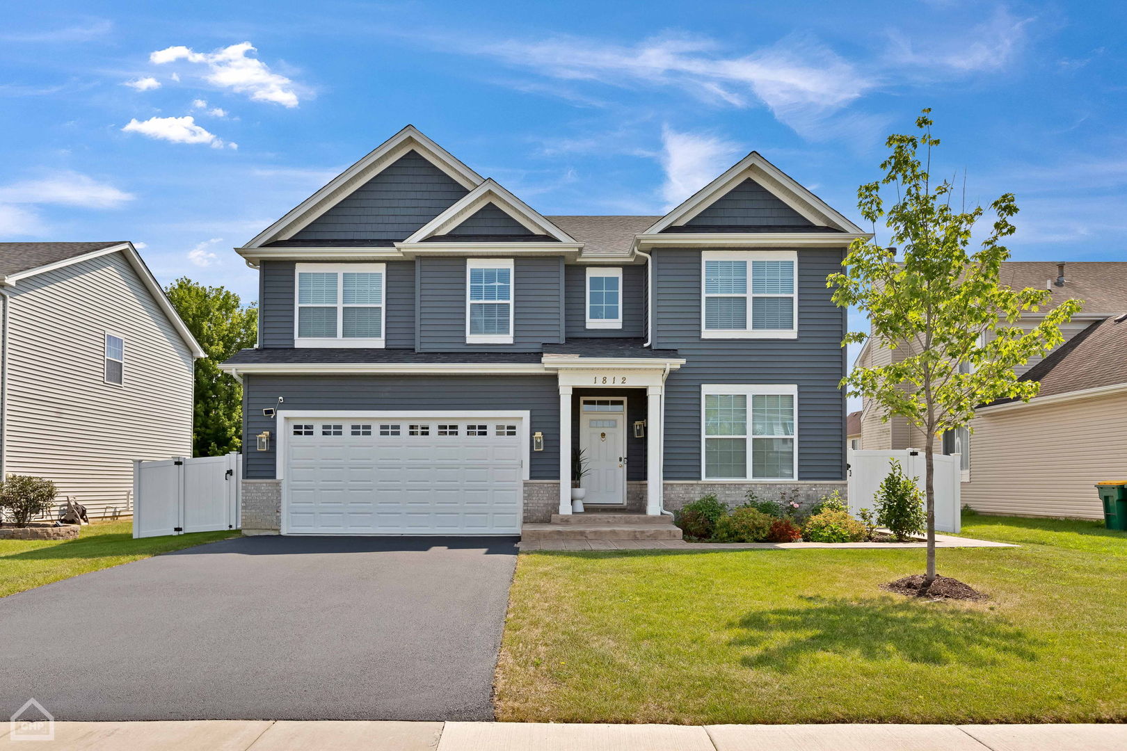 a front view of a house with yard