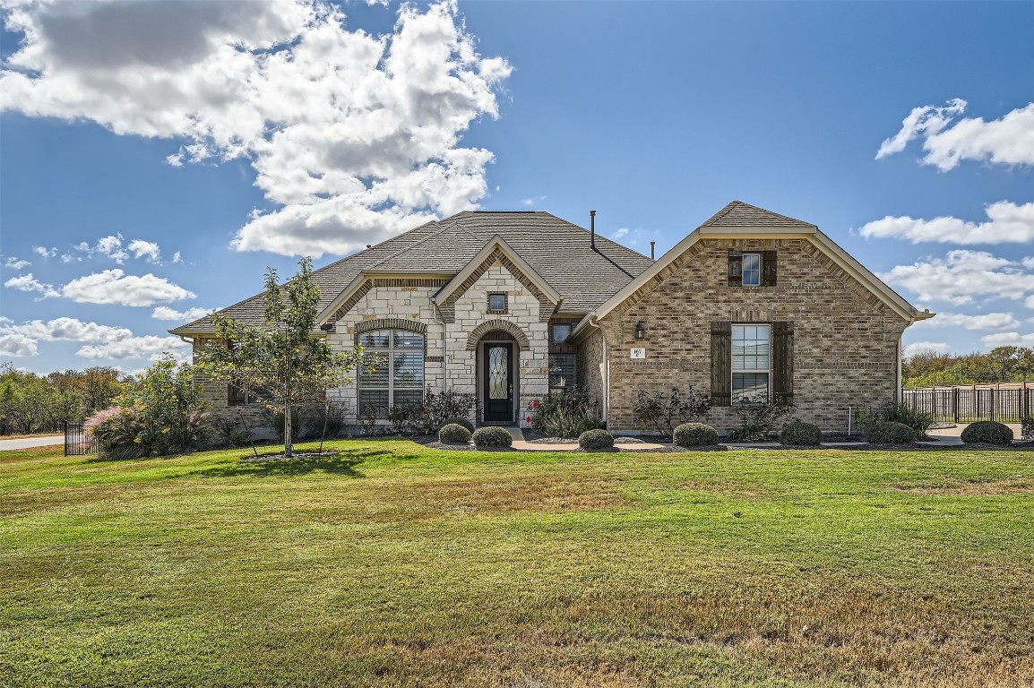 a front view of a house with a yard