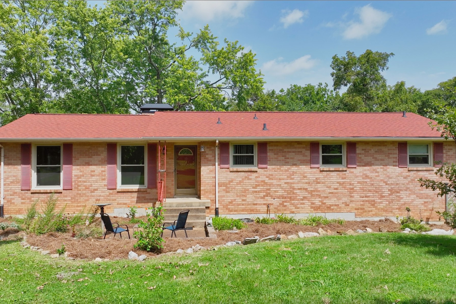 front view of a house with a yard