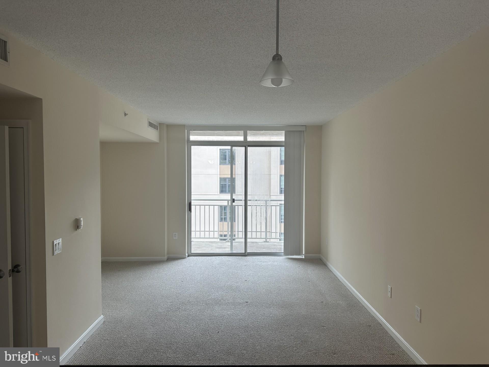 a view of empty room with windows