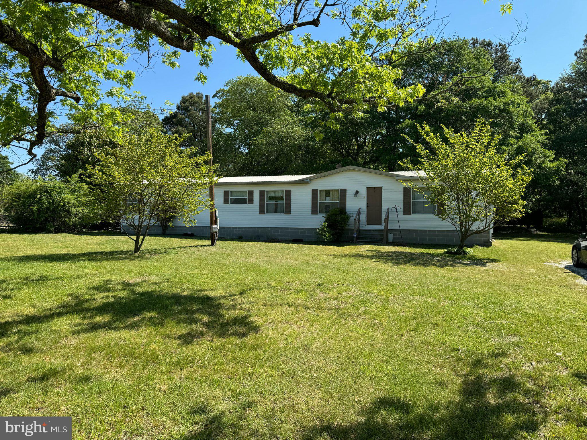 a view of a house with a backyard